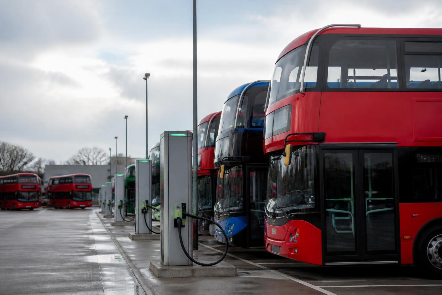 Bus Fleet Insurance 2 Row of double deck and electric buses parked at a UK bus depot with charging posts