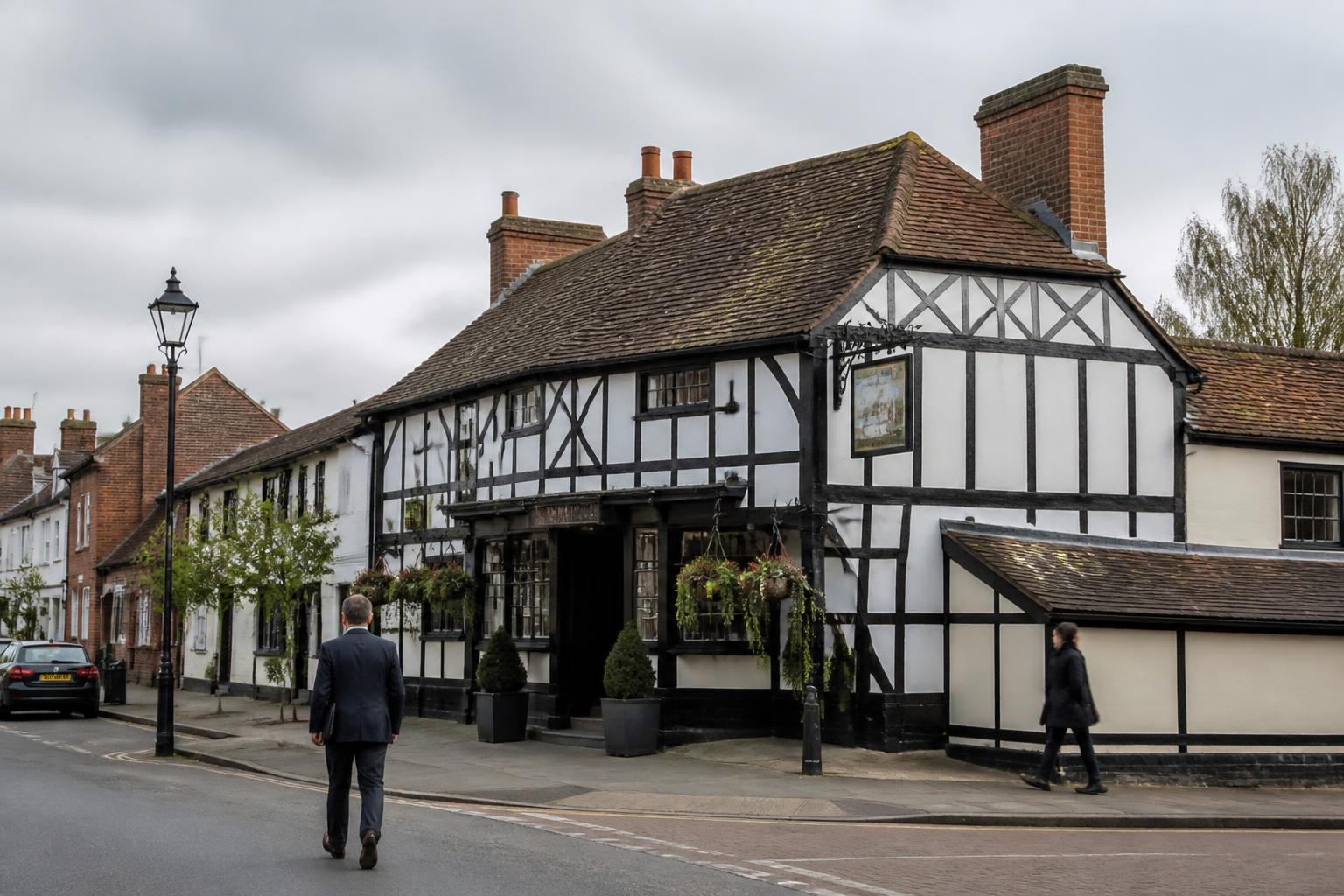 Listed Building Insurance 2 Timber framed coaching inn with a traditional sign in a UK market town